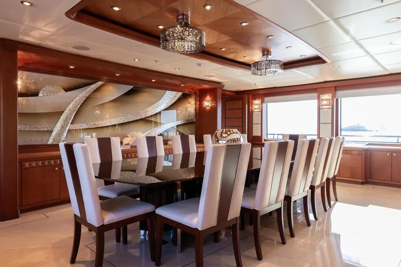 Skyfall Yacht Photos Pics Luxurious dining area on 2010 Trinity Yachts motor yacht with elegant decor and seating.