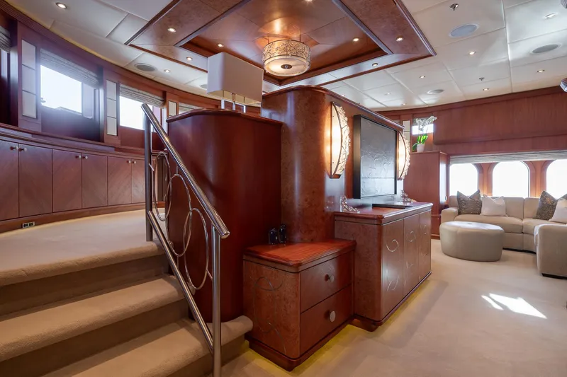 Skyfall Yacht Photos Pics Luxurious interior of 2010 Trinity Yachts motor yacht with elegant wood finishes and plush seating.