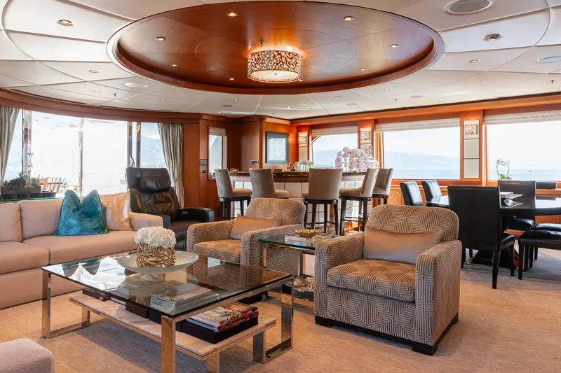 Skyfall Yacht Photos Pics Luxurious interior of 2010 Trinity Yachts motor yacht with elegant seating and dining area.