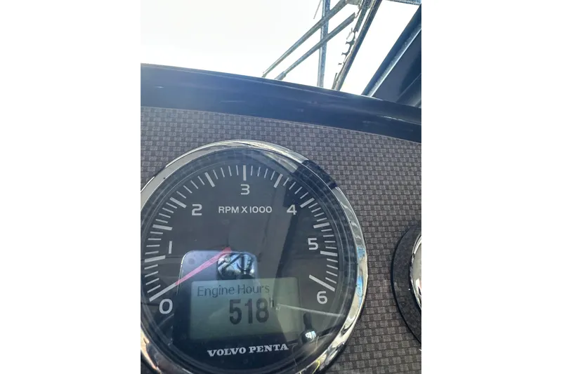 Just Traded Yacht Photos Pics Close-up of 2014 Regal 35 Sport Coupe tachometer showing 518 engine hours.