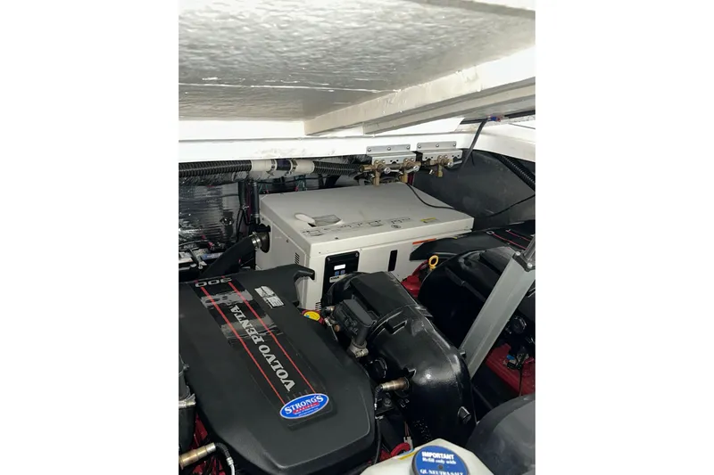 Just Traded Yacht Photos Pics Engine compartment of a 2014 Regal 35 Sport Coupe with Volvo Penta components.