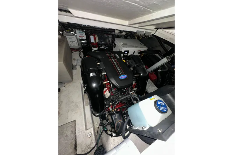 Just Traded Yacht Photos Pics Engine compartment of a 2014 Regal 35 Sport Coupe boat, showcasing detailed components.