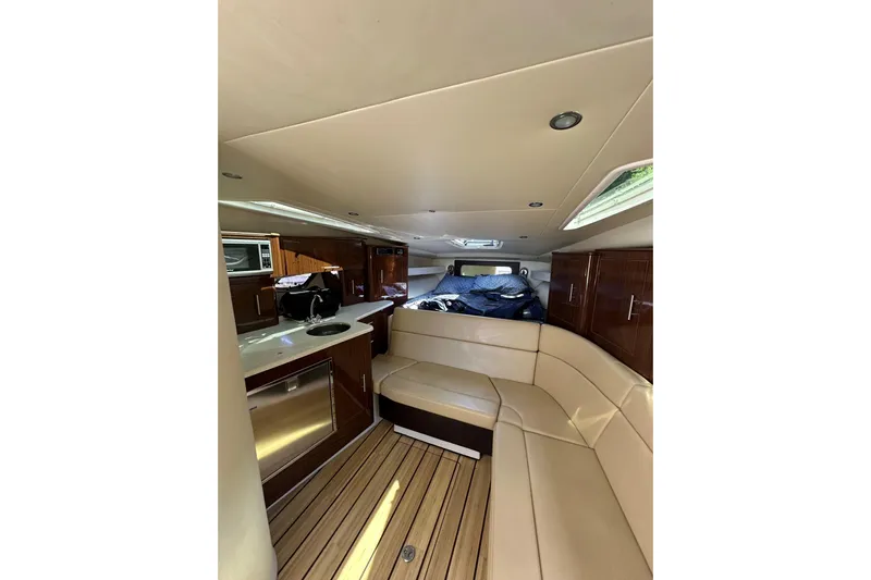 Just Traded Yacht Photos Pics Luxurious interior of 2014 Regal 35 Sport Coupe with modern amenities and elegant design.