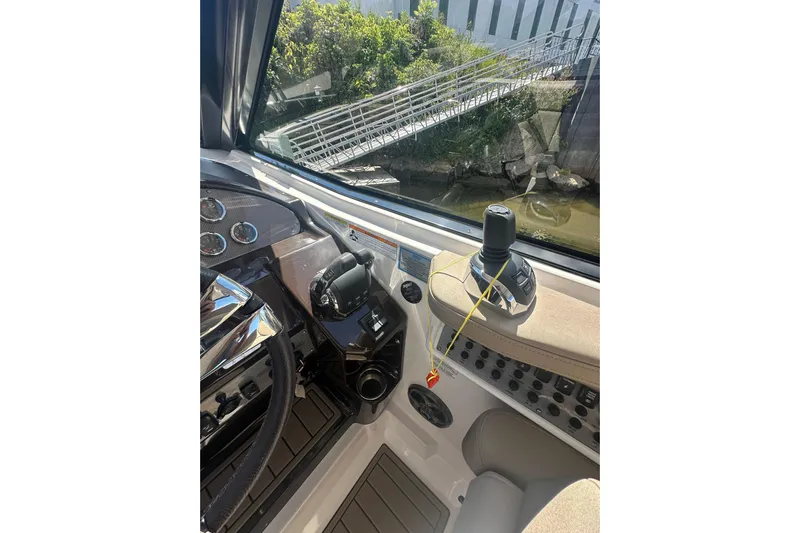Just Traded Yacht Photos Pics 2014 Regal 35 Sport Coupe helm with controls and dashboard view.