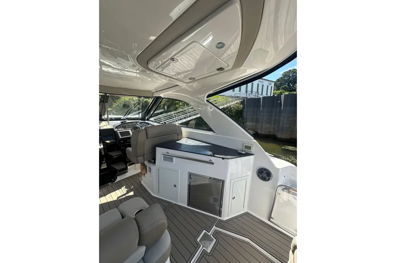 Just Traded Yacht Photos Pics Interior of 2014 Regal 35 Sport Coupe yacht with modern seating and sleek design.