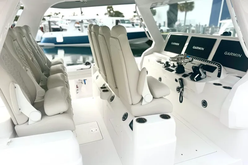  Yacht Photos Pics Luxurious interior of 2025 Intrepid 51 Panacea boat with advanced Garmin navigation systems.