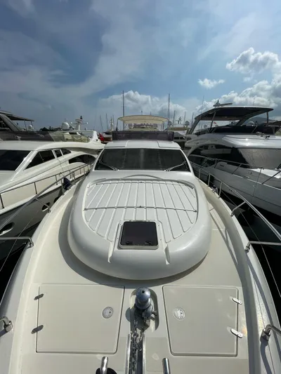  Yacht Photos Pics 2007 Ferretti Yachts 630 docked among other luxury boats under a partly cloudy sky.