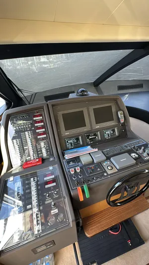  Yacht Photos Pics Control panel of a 2007 Ferretti Yachts 630, featuring navigation screens and instrumentation.