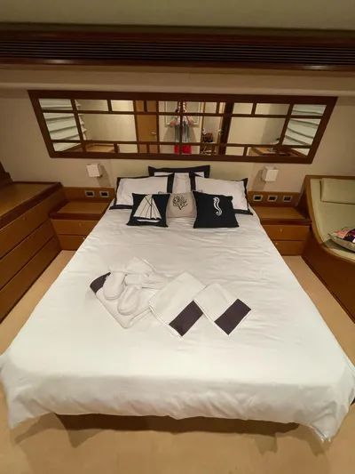  Yacht Photos Pics Luxurious bedroom interior of 2007 Ferretti Yachts 630 with elegant bedding and decor.