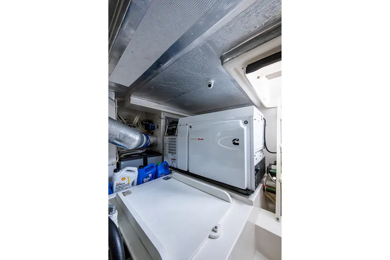 Tank Woo Yacht Photos Pics Engine room of 2018 Maritimo M54 yacht with Cummins Onan generator.