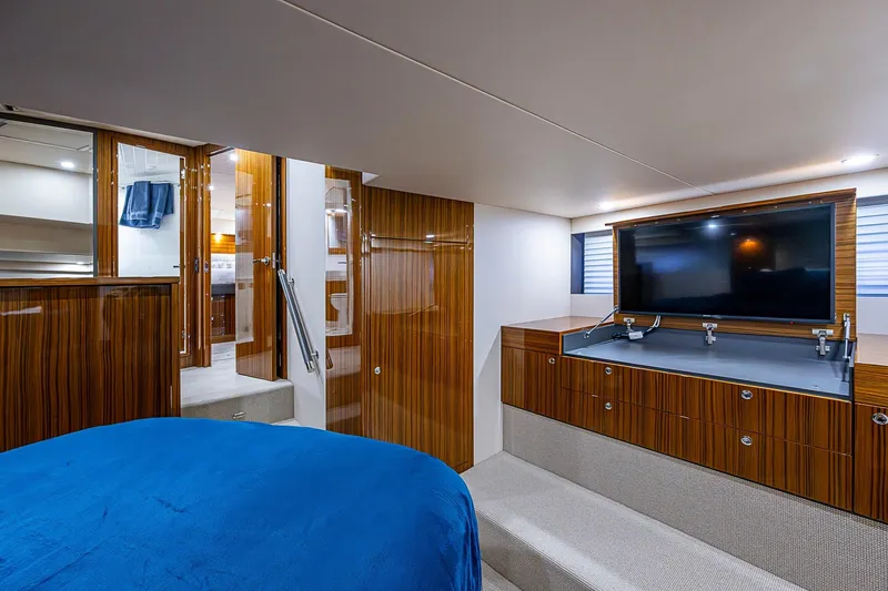 Tank Woo Yacht Photos Pics Luxurious interior of 2018 Maritimo M54 yacht with wood paneling and modern amenities.