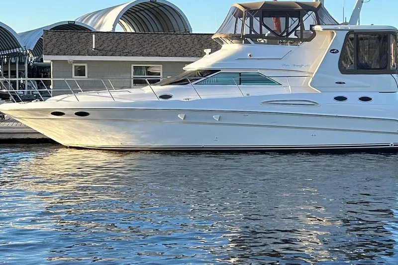 Fathom This Yacht Photos Pics 2001 Sea Ray 420 Aft Cabin yacht docked at marina, reflecting on water.