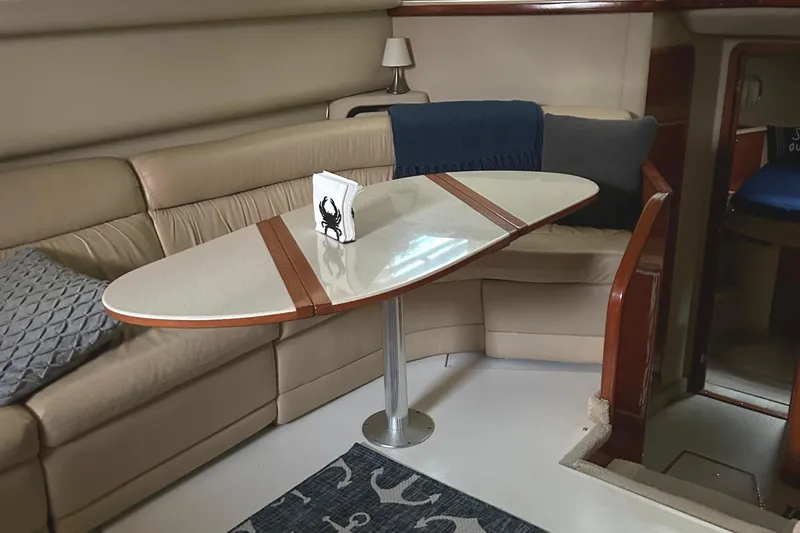 Fathom This Yacht Photos Pics Interior of 2001 Sea Ray 420 Aft Cabin with elegant seating and table.