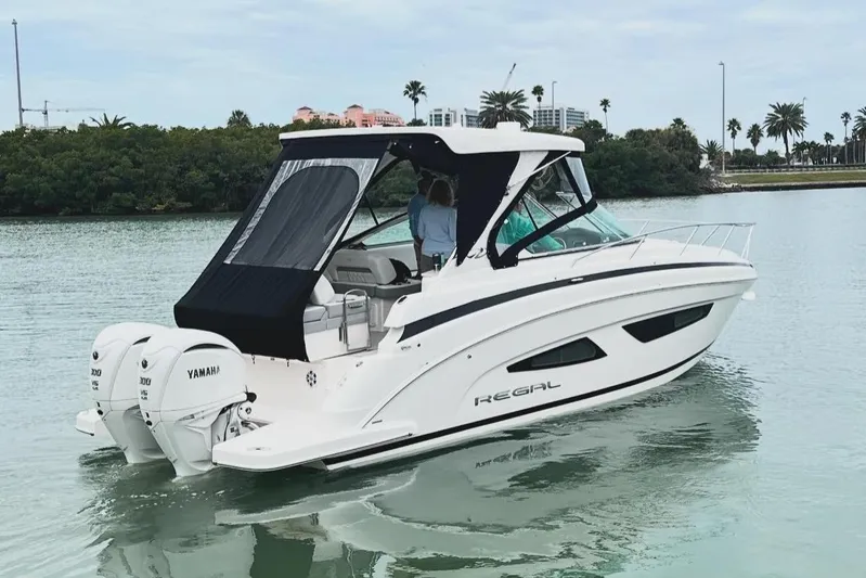Sojourner Yacht Photos Pics 2024 Regal 33 XO boat with Yamaha engines on calm water.