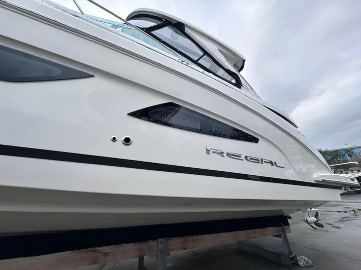 Sojourner Yacht Photos Pics 2024 Regal 33 XO boat side view with sleek design and modern features.