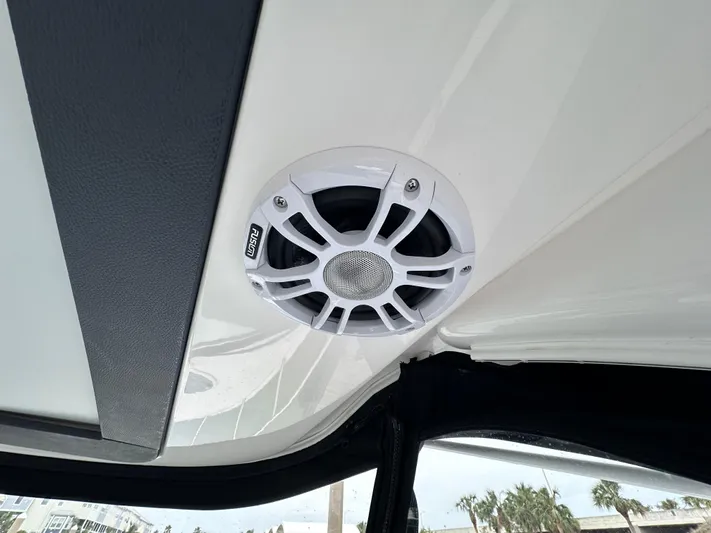 Sojourner Yacht Photos Pics 2024 Regal 33 XO boat speaker on ceiling, white and black design.