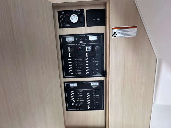 Sojourner Yacht Photos Pics Electrical control panel on a 2024 Regal 33 XO boat interior.