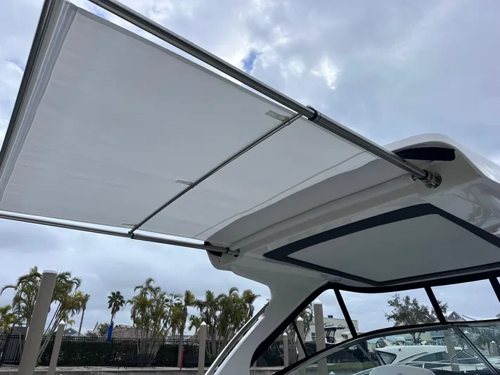 Sojourner Yacht Photos Pics 2024 Regal 33 XO boat with extended sunshade canopy.