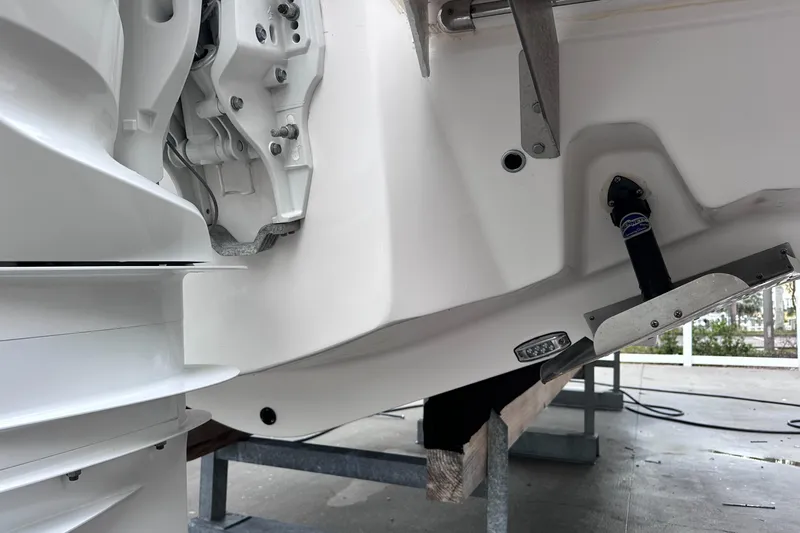 Sojourner Yacht Photos Pics Close-up of 2024 Regal 33 XO boat engine and hull details.