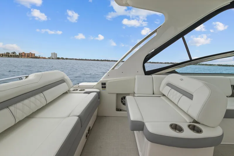 Sojourner Yacht Photos Pics 2024 Regal 33 XO boat interior with luxurious seating and ocean view.