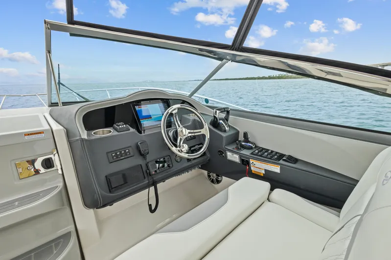 Sojourner Yacht Photos Pics 2024 Regal 33 XO boat helm with modern controls and ocean view.