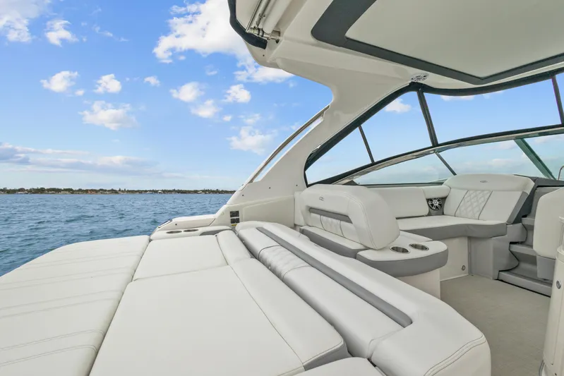Sojourner Yacht Photos Pics 2024 Regal 33 XO luxury boat interior with plush seating and ocean view.