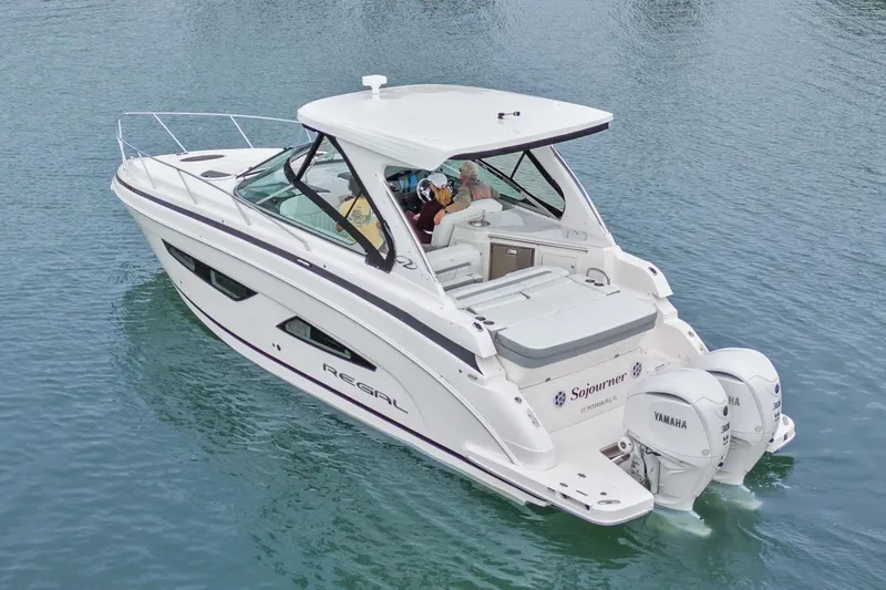 Sojourner Yacht Photos Pics 2024 Regal 33 XO boat on water, featuring dual Yamaha engines.