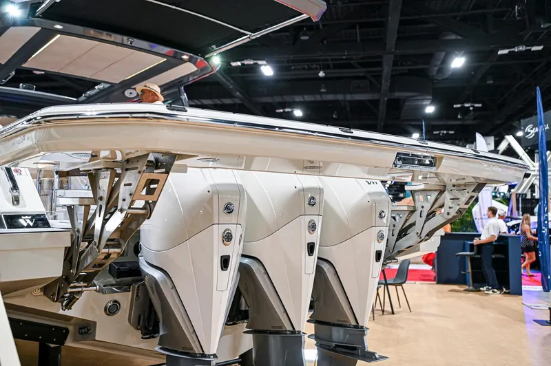  Yacht Photos Pics 2024 Wiszniewski Yachts W43 with powerful outboard engines at a boat show.