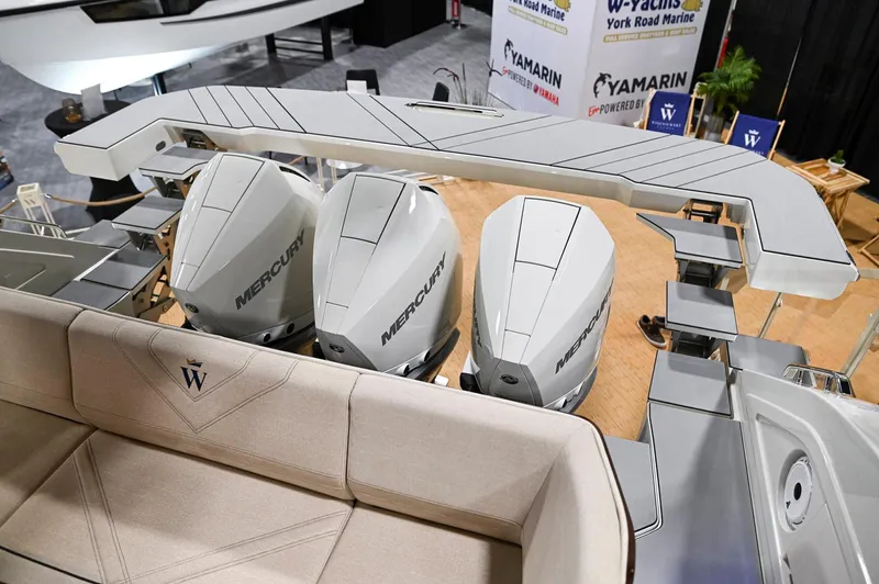  Yacht Photos Pics 2024 Wiszniewski Yachts W43 with triple Mercury engines at a boat show display.