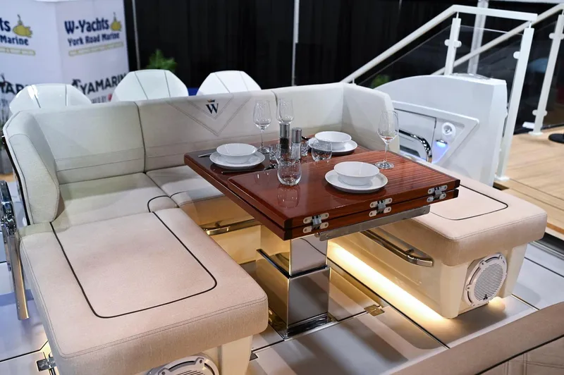  Yacht Photos Pics Luxurious 2024 Wiszniewski Yachts W43 interior with elegant dining setup and plush seating.