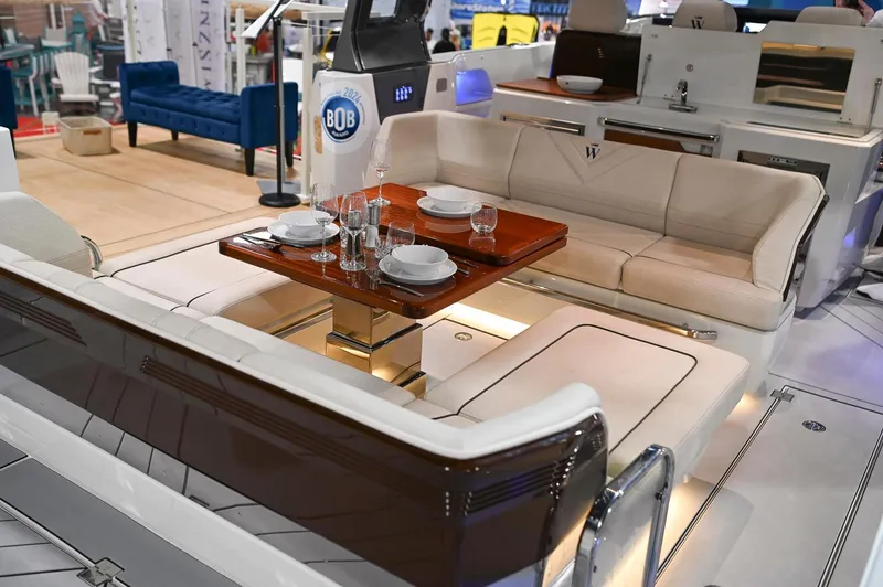  Yacht Photos Pics Luxurious 2024 Wiszniewski Yachts W43 interior with elegant dining setup and plush seating.