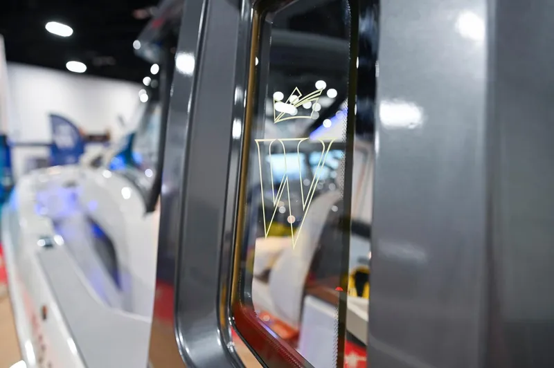  Yacht Photos Pics 2024 Wiszniewski Yachts W43 window detail with logo at a boat show.