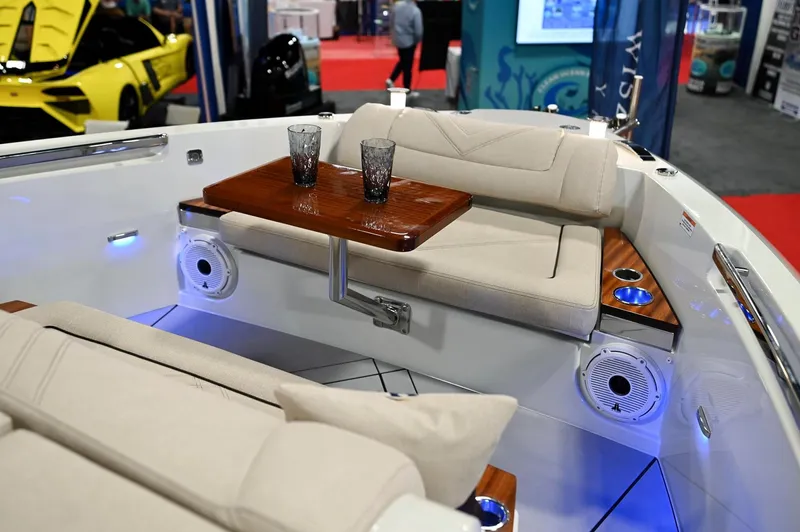  Yacht Photos Pics Luxurious seating area on 2024 Wiszniewski Yachts W43 with elegant table and ambient lighting.