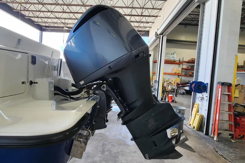  Yacht Photos Pics 2012 SeaVee 340B boat with powerful outboard motor in a garage setting.