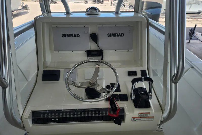  Yacht Photos Pics 2012 SeaVee 340B boat helm with Simrad electronics and steering wheel.