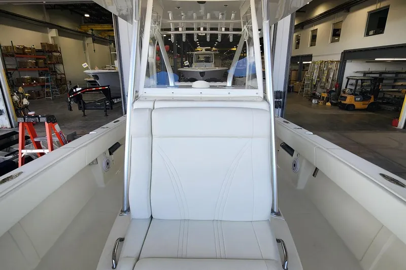  Yacht Photos Pics 2012 SeaVee 340B boat interior with white seating in a workshop setting.