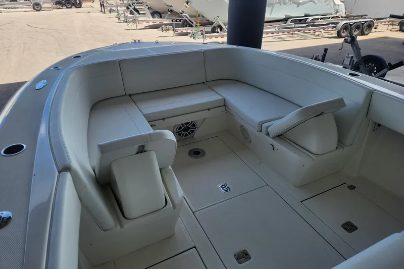  Yacht Photos Pics 2012 SeaVee 340B boat interior with cushioned seating and storage compartments.