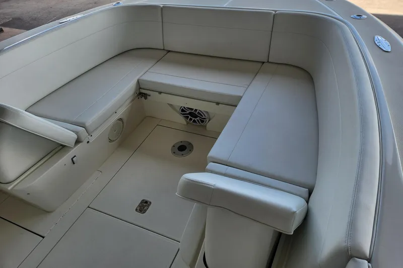  Yacht Photos Pics 2012 SeaVee 340B boat interior with cushioned seating and storage compartments.