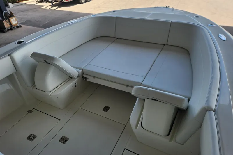  Yacht Photos Pics 2012 SeaVee 340B boat interior with cushioned seating and storage compartments.