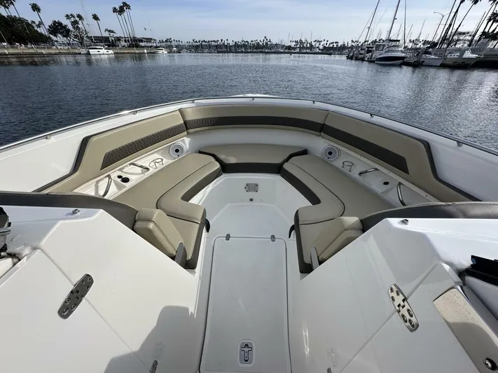 Always Grateful 2 Yacht Photos Pics 2021 Pursuit DC 326 Dual Console boat interior with seating, docked in a marina.