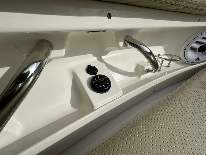 Always Grateful 2 Yacht Photos Pics 2021 Pursuit DC 326 Dual Console interior with control panel and speaker.