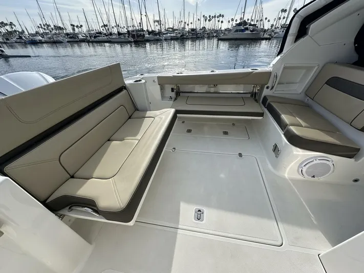 Always Grateful 2 Yacht Photos Pics 2021 Pursuit DC 326 Dual Console boat interior with seating, docked at marina.