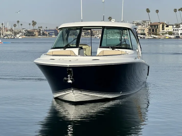 Always Grateful 2 Yacht Photos Pics 2021 Pursuit DC 326 Dual Console boat on calm water, coastal background.
