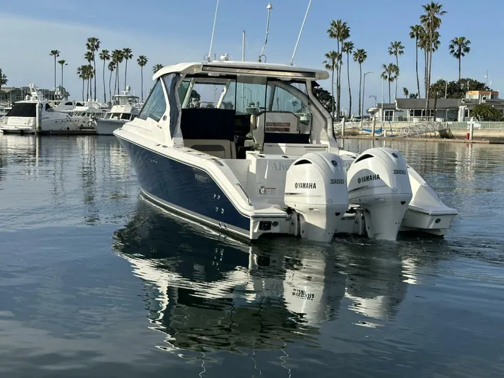Always Grateful 2 Yacht Photos Pics 2021 Pursuit DC 326 Dual Console boat with twin Yamaha engines on calm water.
