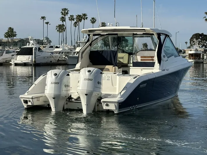 Always Grateful 2 Yacht Photos Pics 2021 Pursuit DC 326 Dual Console boat docked in a marina with twin engines.