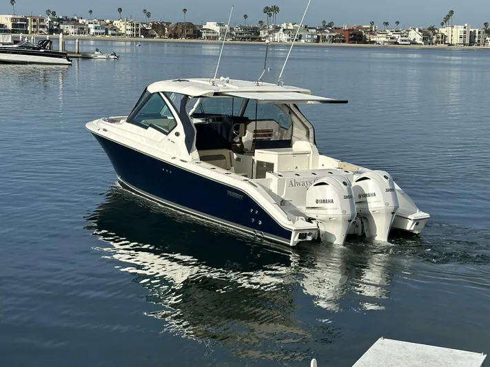 Always Grateful 2 Yacht Photos Pics 2021 Pursuit DC 326 Dual Console boat with twin Yamaha engines on calm water.