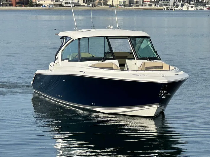 Always Grateful 2 Yacht Photos Pics 2021 Pursuit DC 326 Dual Console boat on calm water.