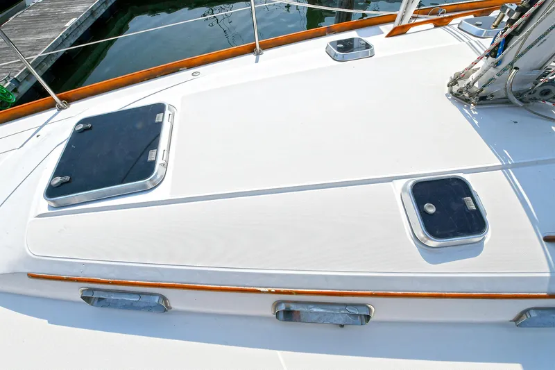 The Verdict III Yacht Photos Pics Deck of 2002 Sabre 452 sailboat with hatches and wooden trim.