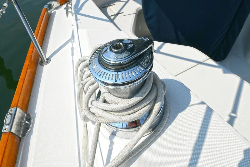 The Verdict III Yacht Photos Pics Sailboat winch with rope on deck, Sabre 452, 2002 model.