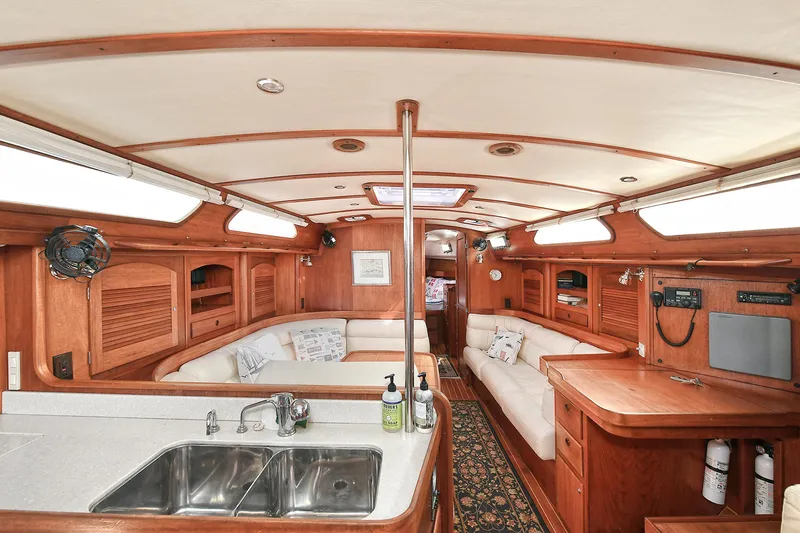 The Verdict III Yacht Photos Pics Luxurious 2002 Sabre 452 yacht interior with wood finish and modern amenities.